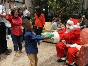 Santa hands out presents at the EPS holiday party